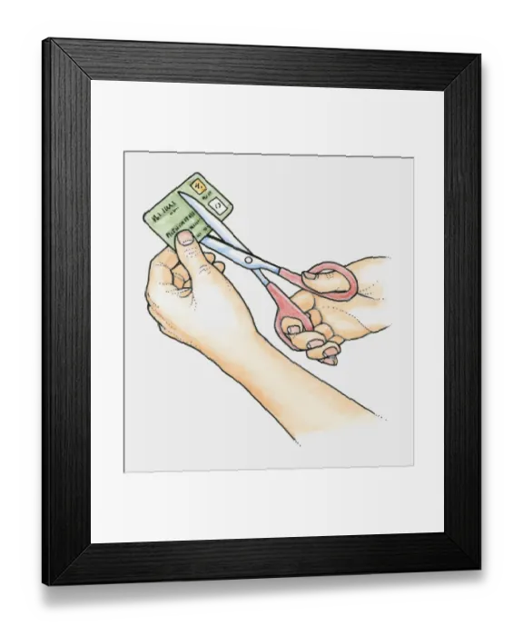 Framed Print : Hands using scissors to cut up an old credit card Framed Print : Hands using scissors to cut up an old credit card