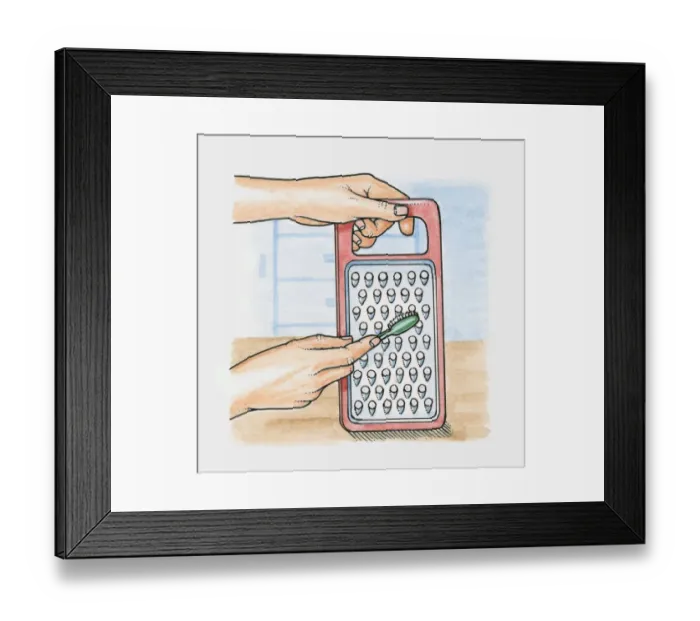 Framed Print : Using a toothbrush to clean a grater Framed Print : Using a toothbrush to clean a grater