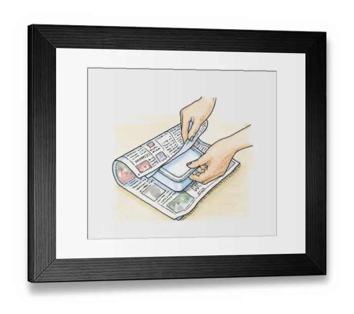 Framed Print : Hands wrapping frozen food in newspapers to keep it cool Framed Print : Hands wrapping frozen food in newspapers to keep it cool