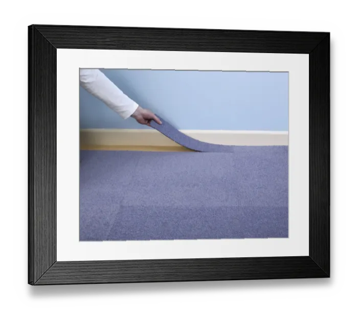 Framed Print : Man installing blue carpet tile next to skirting board Framed Print : Man installing blue carpet tile next to skirting board