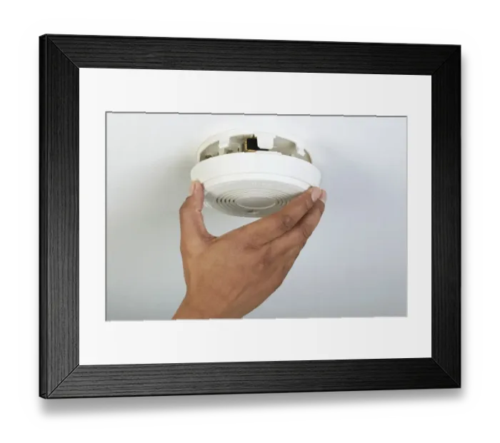 Framed Print : Man installing smoke detector, close-up Framed Print : Man installing smoke detector, close-up