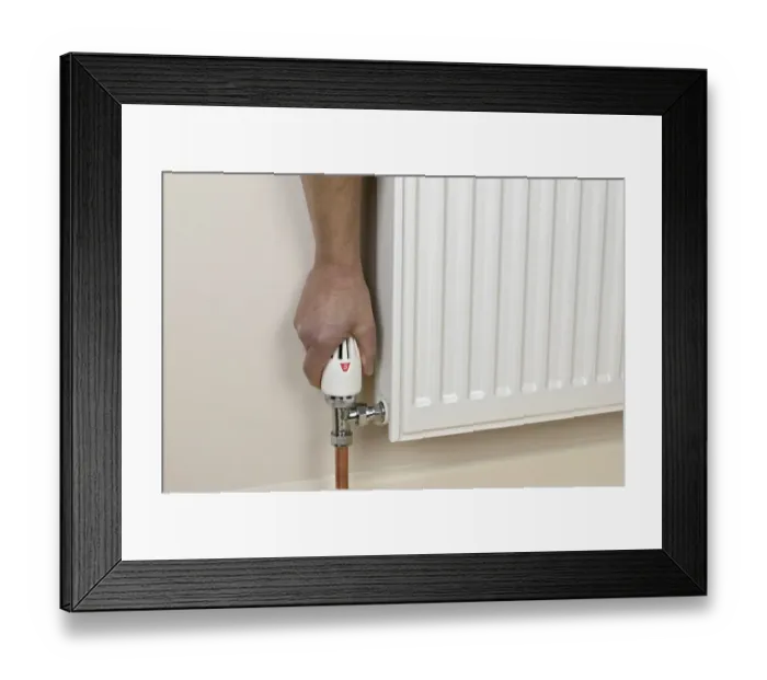 Framed Print : Hand on handwheel valve of radiator Framed Print : Hand on handwheel valve of radiator