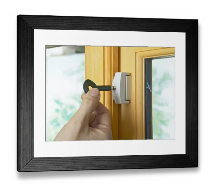 Framed Print : Locking casement window lock with the key Framed Print : Locking casement window lock with the key