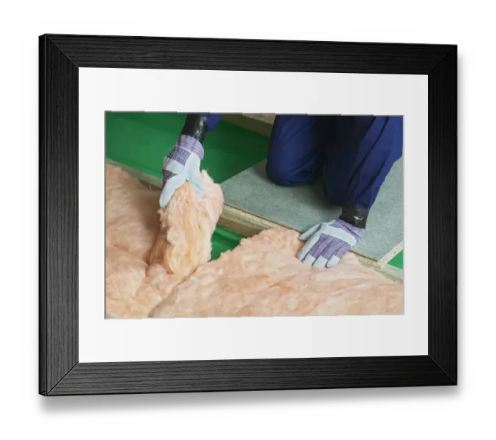 Framed Print : Man wearing overalls, gloves joining end of insulation blanket together