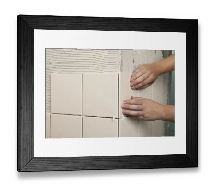 Framed Print : Two hands pressing on tile on wall Framed Print : Two hands pressing on tile on wall