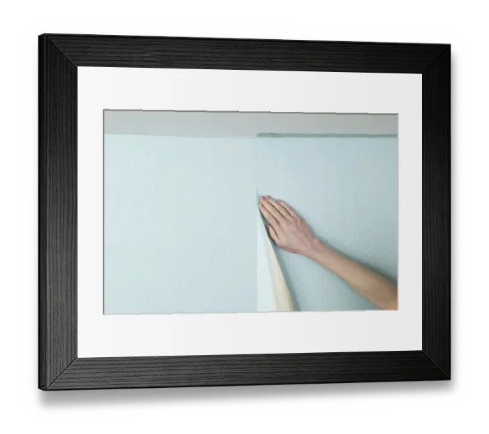 Framed Print : Person smoothing wall paper onto a wall Framed Print : Person smoothing wall paper onto a wall