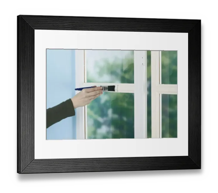 Framed Print : Person painting window frame with a brush Framed Print : Person painting window frame with a brush