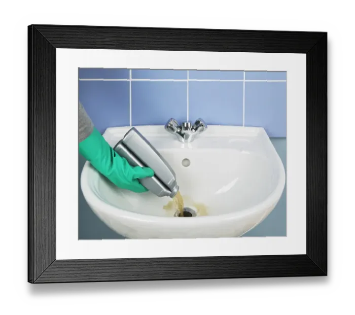 Framed Print : Pouring chemicals down a sink