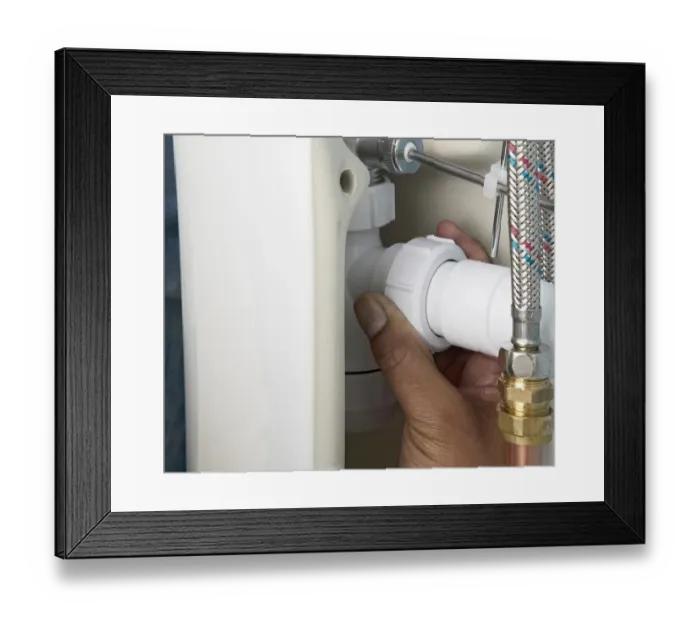 Framed Print : Screwing a trap connector nut onto a waste pipe Framed Print : Screwing a trap connector nut onto a waste pipe
