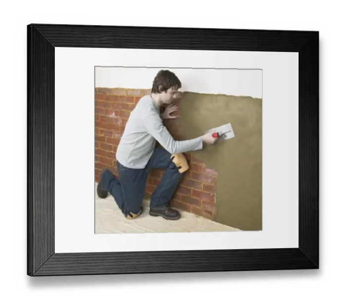 Framed Print : Man applying waterproof render to a wall with a trowel
