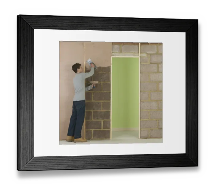 Framed Print : Man applying plaster to wall Framed Print : Man applying plaster to wall