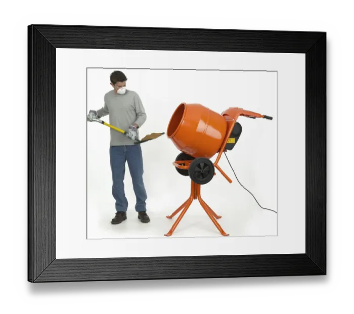 Framed Print : Man shovelling mixture into cement mixer Framed Print : Man shovelling mixture into cement mixer