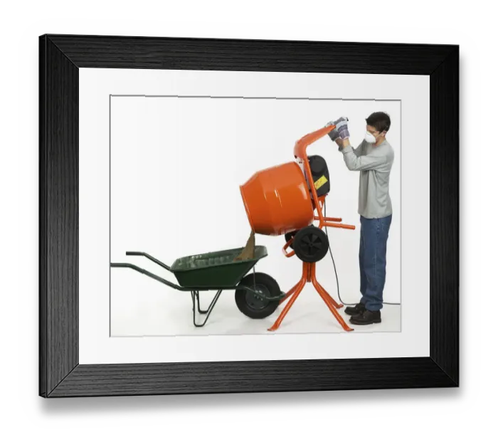 Framed Print : Man emptying contents of cement mixer into a wheelbarrow Framed Print : Man emptying contents of cement mixer into a wheelbarrow