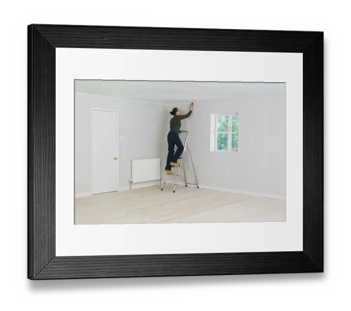 Framed Print : Woman on ladder painting edge of ceiling Framed Print : Woman on ladder painting edge of ceiling