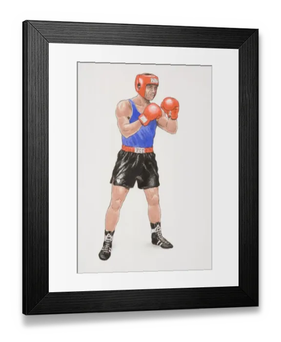 Framed Print : Boxer wearing black shorts, blue vest, red gloves and head protector, standing poised with legs apart and arms bent in front of him, side view