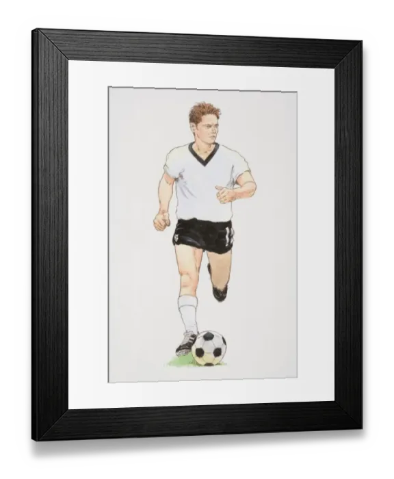 Framed Print : Football player in white T-shirt and black shorts running with football in front of him, front view Framed Print : Football player in white T-shirt and black shorts running with football in front of him, front view