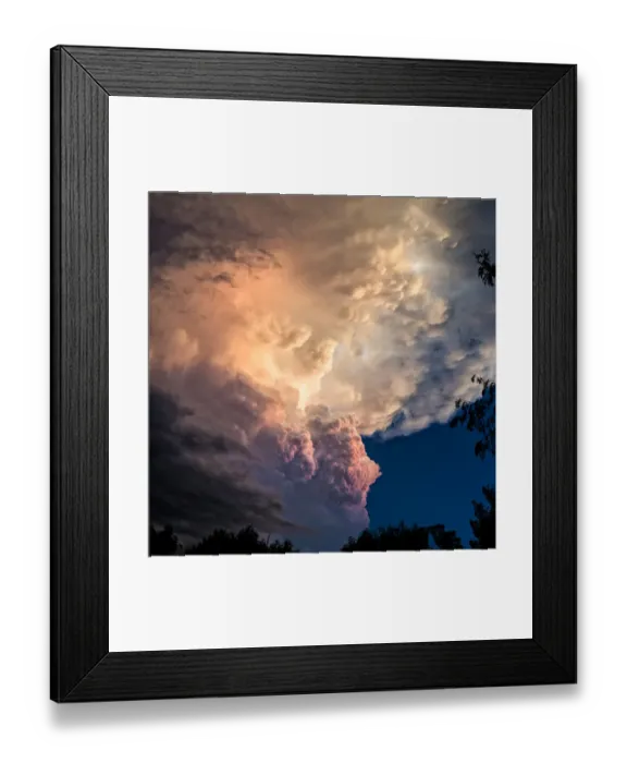 Framed Print : Dramatic storm clouds rolling in at sunset before
