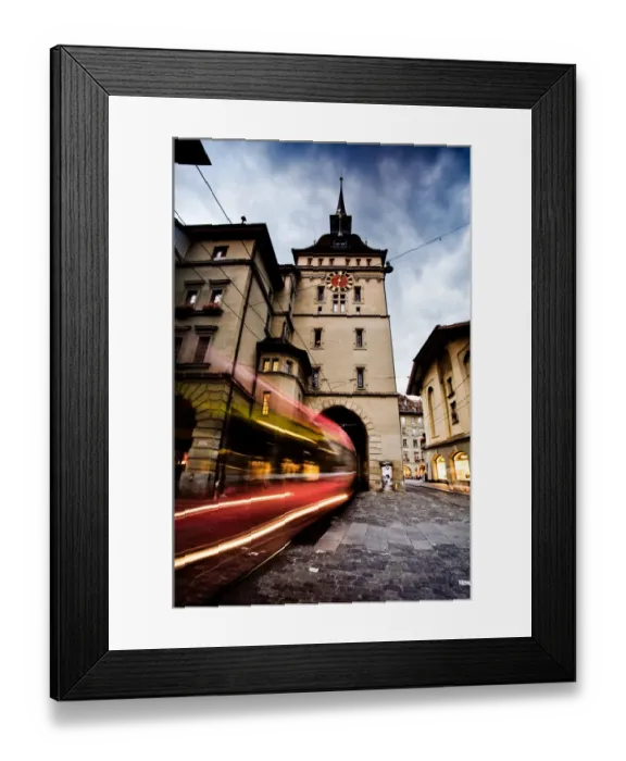 Framed Print : Swallowed. A tram passes under a clock tower in Bern Old Town, Bern, Switzerland Framed Print : Swallowed. A tram passes under a clock tower in Bern Old Town, Bern, Switzerland