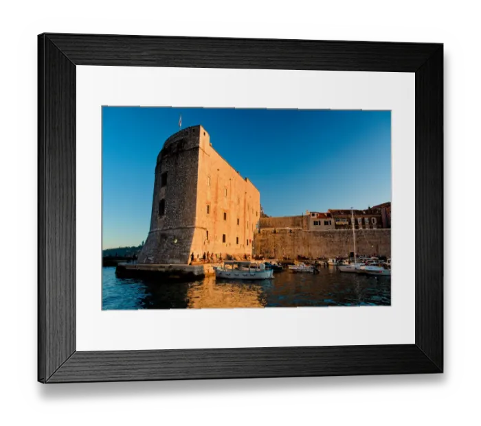 Framed Print : Fortress. Warm light from setting sun lights up entrance to Dubrovnik harbour Framed Print : Fortress. Warm light from setting sun lights up entrance to Dubrovnik harbour