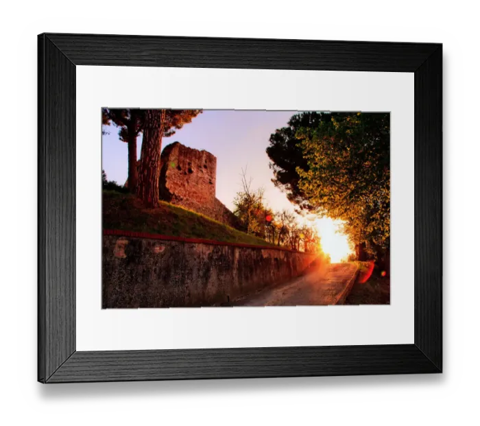 Framed Print : Fortress. Sun sets down road leading castle on hilltop fortress of San Framed Print : Fortress. Sun sets down road leading castle on hilltop fortress of San