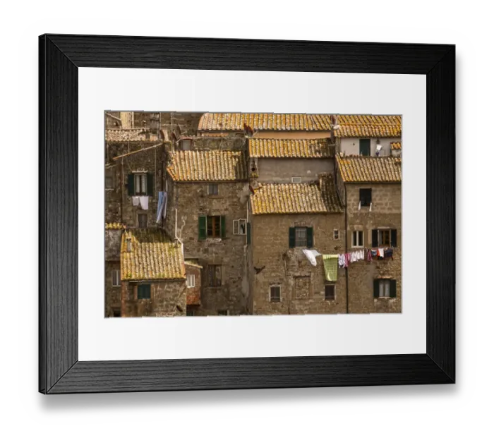 Framed Print : Roof Tops. Washing drying out side windows in the tuscany town of Sorano Framed Print : Roof Tops. Washing drying out side windows in the tuscany town of Sorano