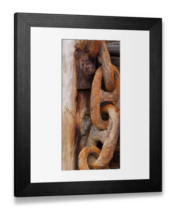 Framed Print : Weatherd. Rusty chain hanging on weathered wood in Cornish boat yard Framed Print : Weatherd. Rusty chain hanging on weathered wood in Cornish boat yard
