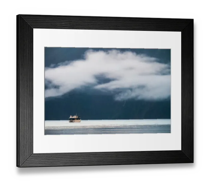 Framed Print : A boat explores Milford Sound Framed Print : A boat explores Milford Sound