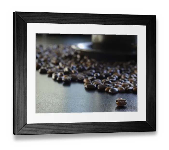 Framed Print : Coffee. A macro shot of a cup and saucer surrounded by coffee beans Framed Print : Coffee. A macro shot of a cup and saucer surrounded by coffee beans