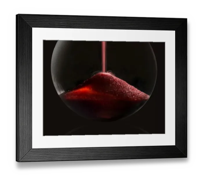 Framed Print : hourglass. A simple and elegant macro photo of red sand pouring into the Framed Print : hourglass. A simple and elegant macro photo of red sand pouring into the