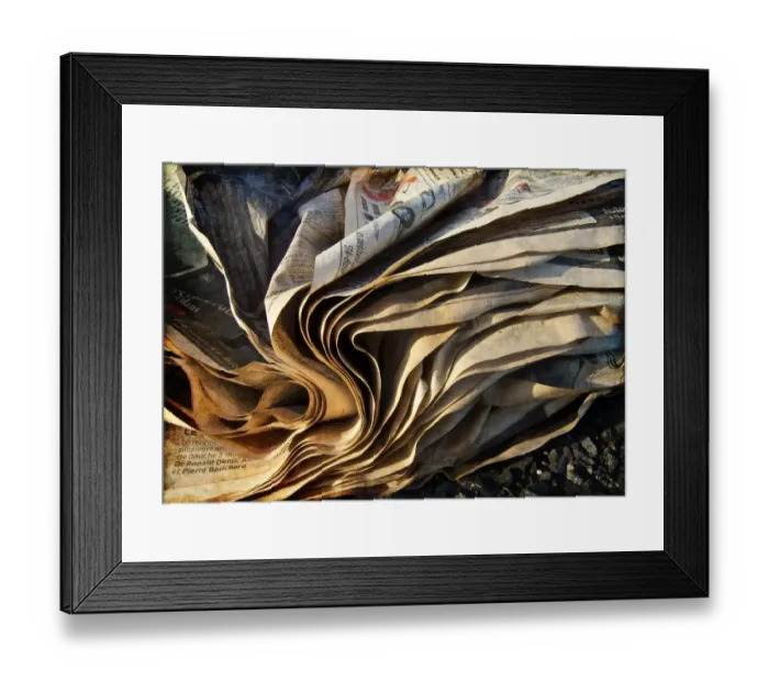 Framed Print : Paper. Weathered newspaper folds photographed in late afternoon sunlight Framed Print : Paper. Weathered newspaper folds photographed in late afternoon sunlight