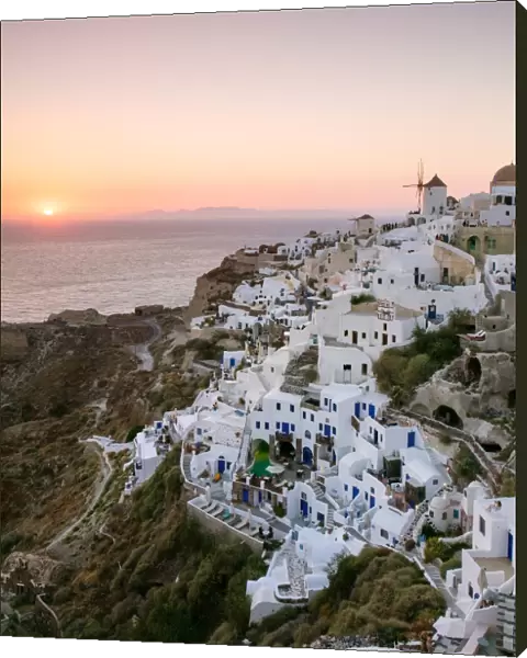 Awesome sunset on town of Oia, Santorini, Greece