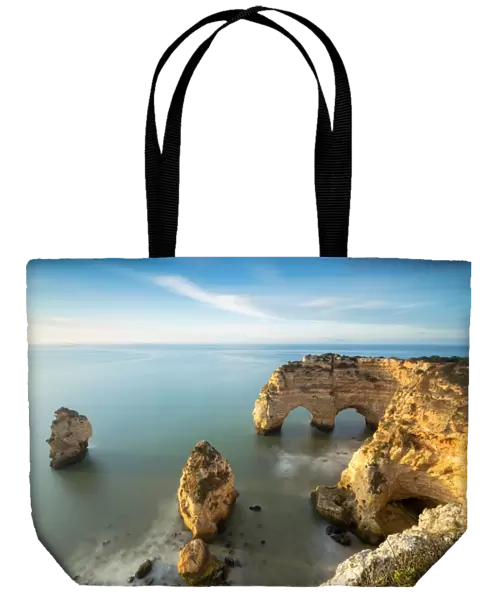 Cliffs framed by turquoise water Praia da Marinha Portugal