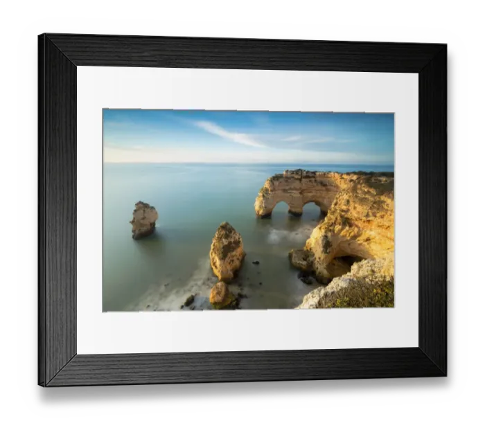 Framed Print : Cliffs framed by turquoise water Praia da Marinha Portugal