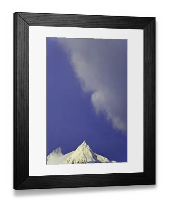 Framed Print : Clouds soaring in blue sky above snowy mountains Framed Print : Clouds soaring in blue sky above snowy mountains
