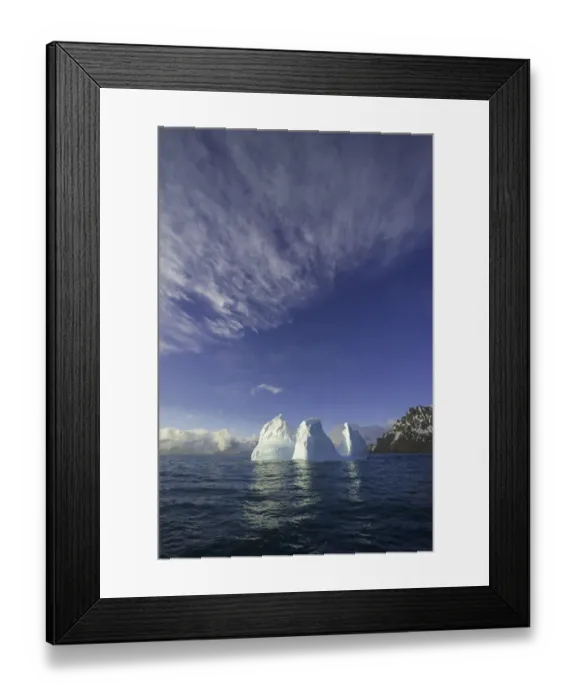 Framed Print : Blue iceberg floating in sea in spring