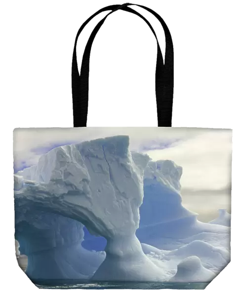 iceberg with arches, Antarctic Peninsula
