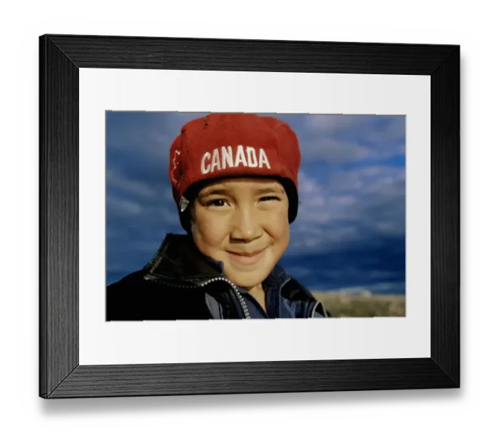 Framed Print : Boy (7-9) smiling, wearing Canada hat, close-up, portrait