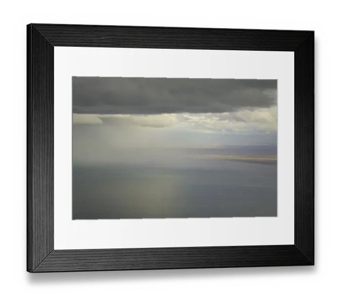 Framed Print : Cumulus clouds and rain showers over sea, aerial view Framed Print : Cumulus clouds and rain showers over sea, aerial view
