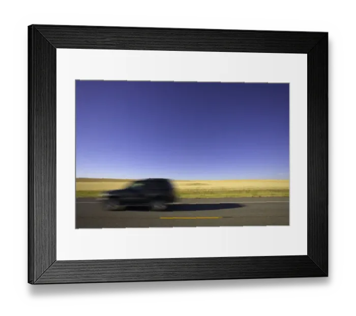 Framed Print : USA, Montana, SUV on highway beside wheatfield (blurred motion) Framed Print : USA, Montana, SUV on highway beside wheatfield (blurred motion)
