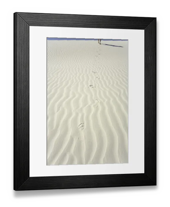 Framed Print : Mature man leaving footprints on white gypsum sand dune, low section