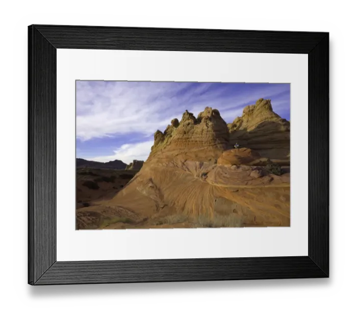 Framed Print : Mature man sitting on sandstone rock, evening Framed Print : Mature man sitting on sandstone rock, evening