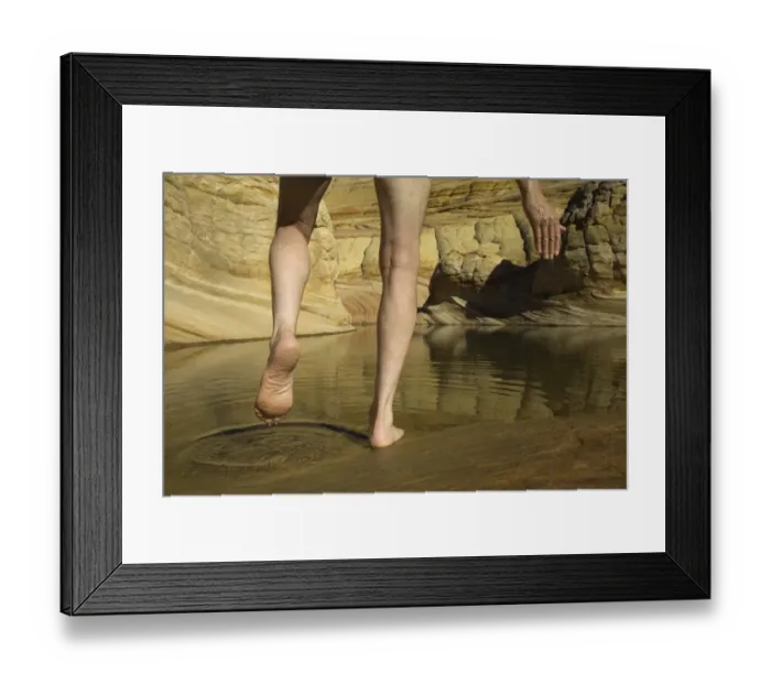 Framed Print : Man stepping into pool of water in sandstone, low section Framed Print : Man stepping into pool of water in sandstone, low section