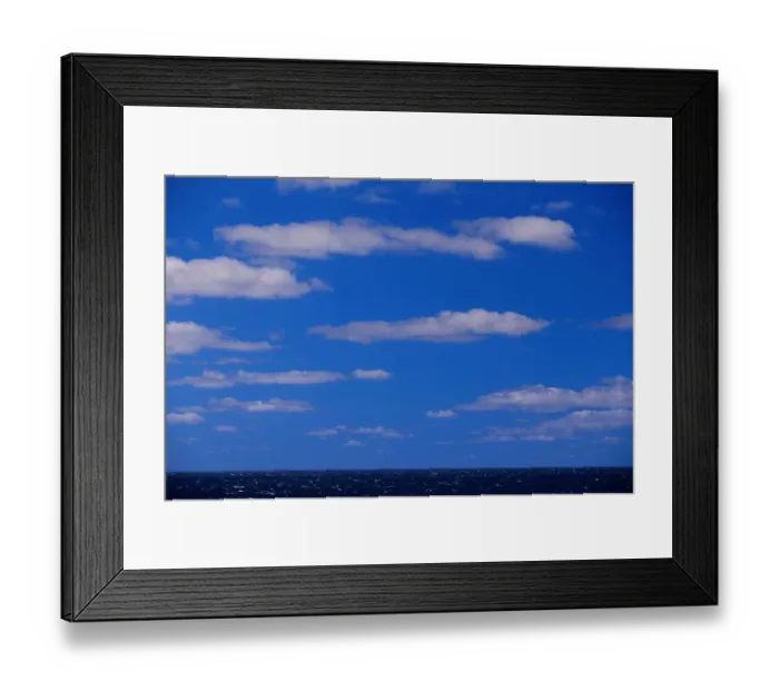 Framed Print : Cumulus clouds scattered over horizon of sky and ocean Framed Print : Cumulus clouds scattered over horizon of sky and ocean