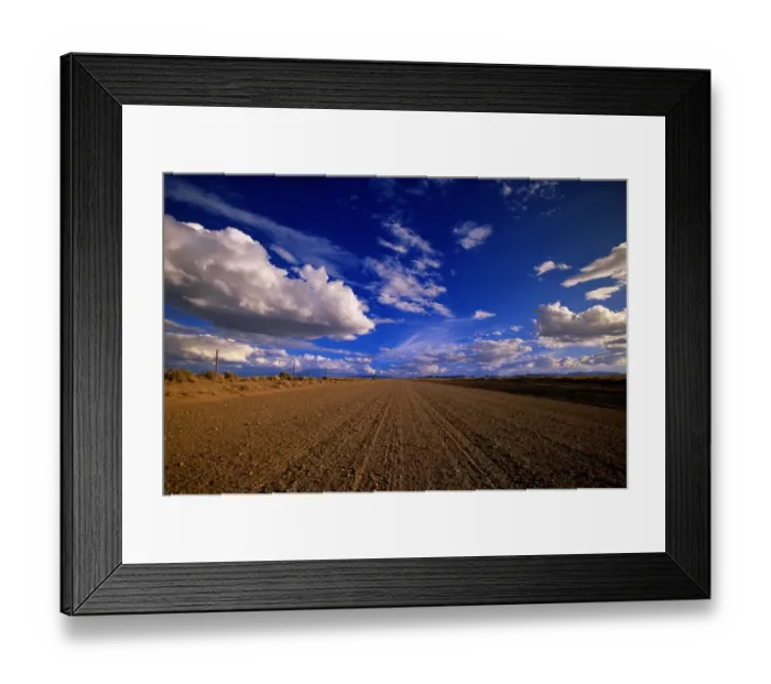 Framed Print : USA, Colorado, cumulus clouds over country gravel road in summer Framed Print : USA, Colorado, cumulus clouds over country gravel road in summer
