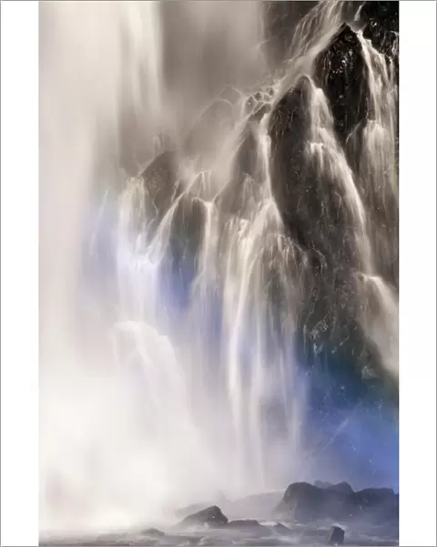 Waterfall with faint rainbow, blue spectrum, Bridal Veil Falls, Kanai Penninsula