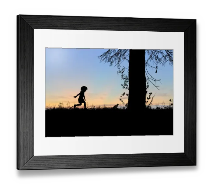 Framed Print : Child playing behind a frog Framed Print : Child playing behind a frog