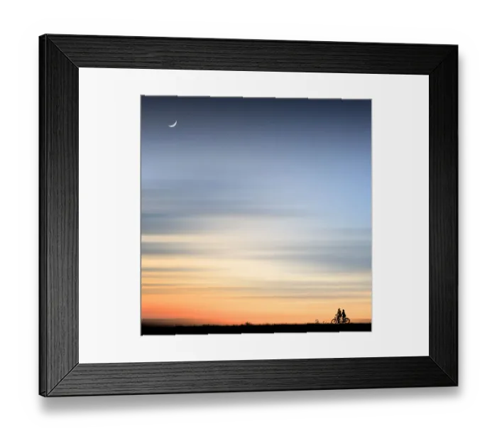 Framed Print : Happy couple riding a bicycle Framed Print : Happy couple riding a bicycle