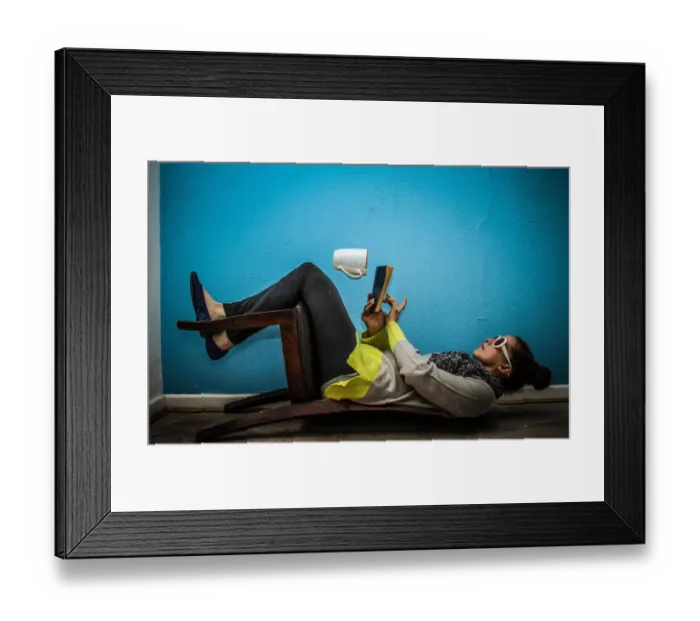 Framed Print : Unusual. trick photography model sitting on a chair upside down Framed Print : Unusual. trick photography model sitting on a chair upside down