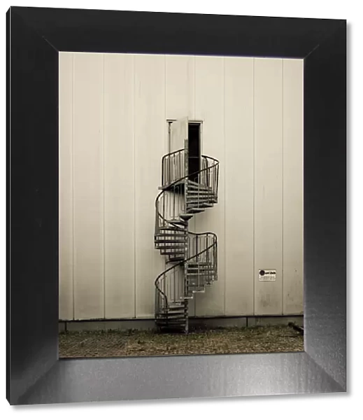 Spiral staircase with open door