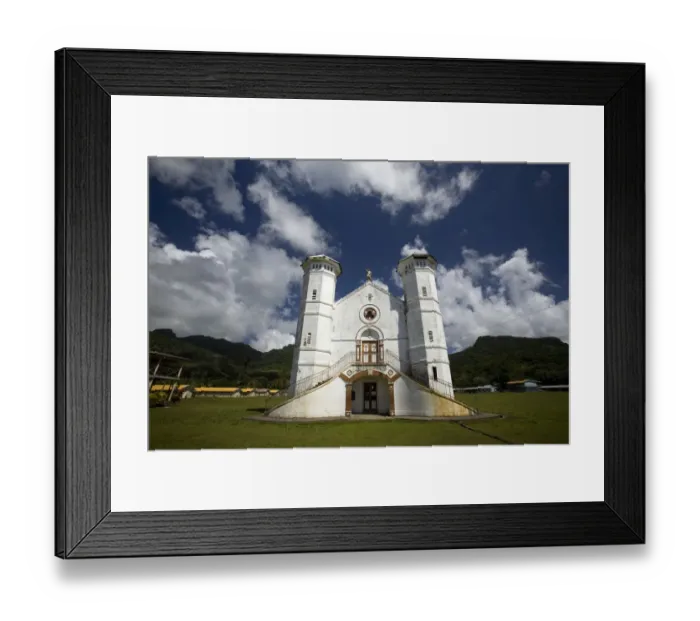 Framed Print : White church on a grass field with blue sky Framed Print : White church on a grass field with blue sky